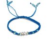 BR-070400350035 Handmade macramé braided string pull tie bracelet with silver metal wire wrapped clear quartz crystal centerpiece in turquoise blue color.