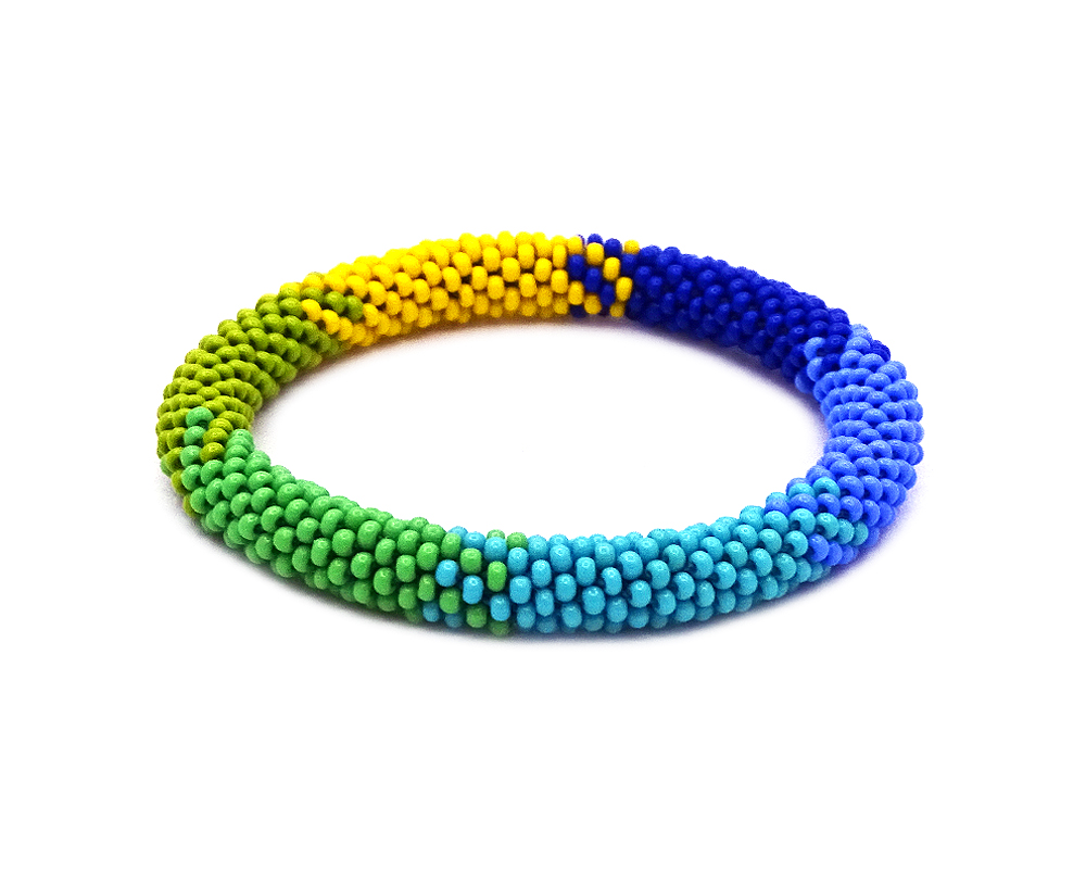 Handmade Czech glass seed bead bangle bracelet with multicolored pattern design in blue, light blue, turquoise, green, lime green, and yellow color combination.