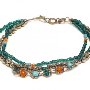 Handmade seed bead and silver metal bead multi strand bracelet with beaded chain link loop centerpiece in teal green, orange, and turquoise mint color combination.