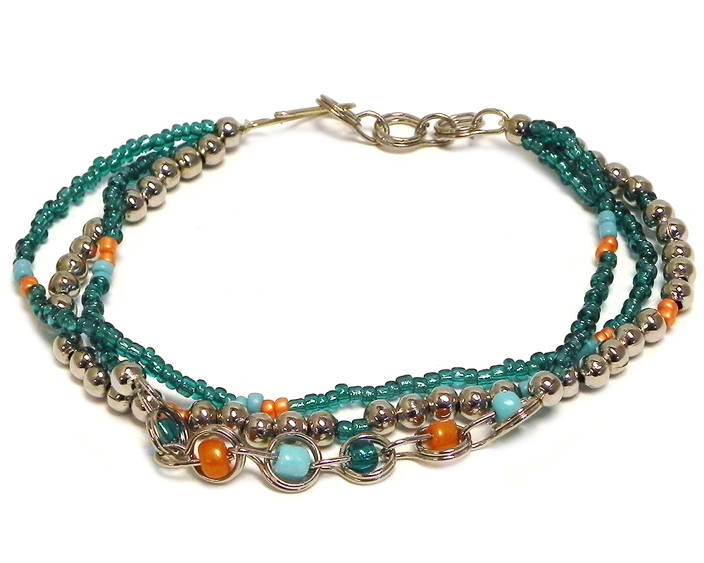 Handmade seed bead and silver metal bead multi strand bracelet with beaded chain link loop centerpiece in teal green, orange, and turquoise mint color combination.