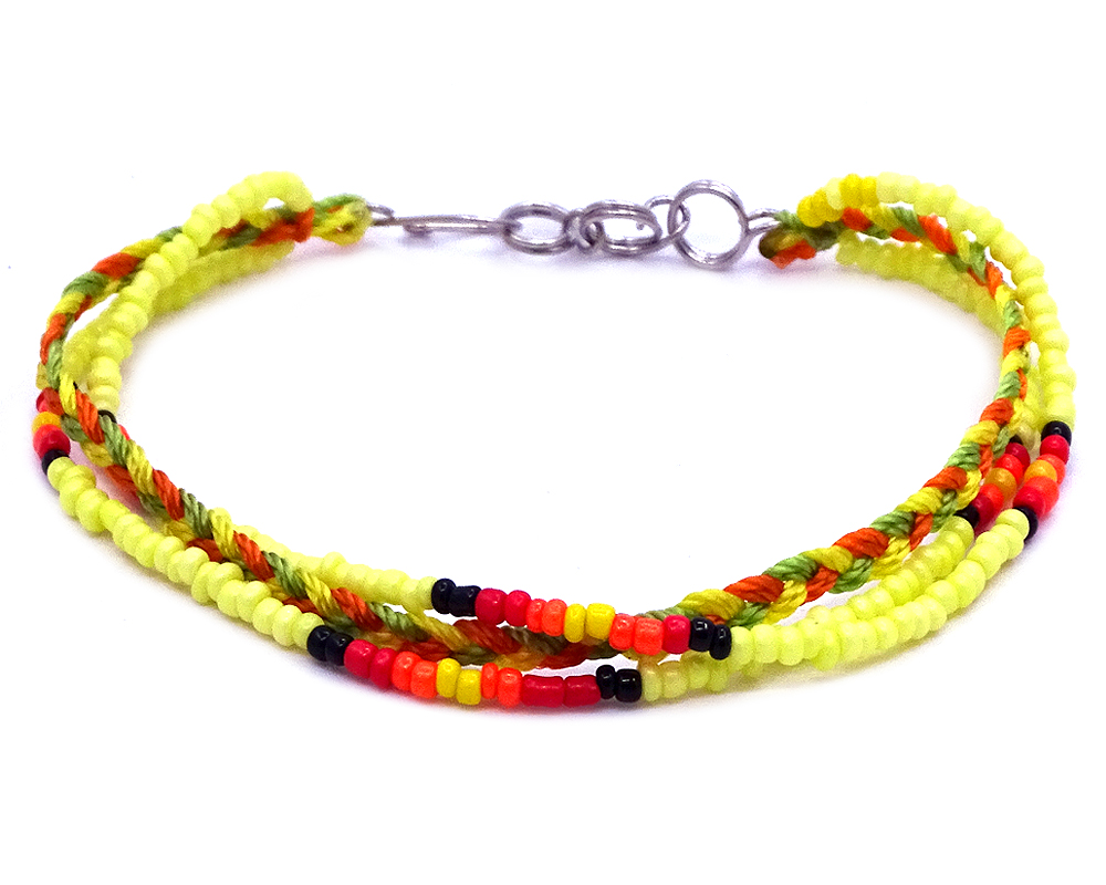 Handmade Native American inspired seed bead and macramé braided string multi strand bracelet in yellow, lime green, orange, black, and red color combination.