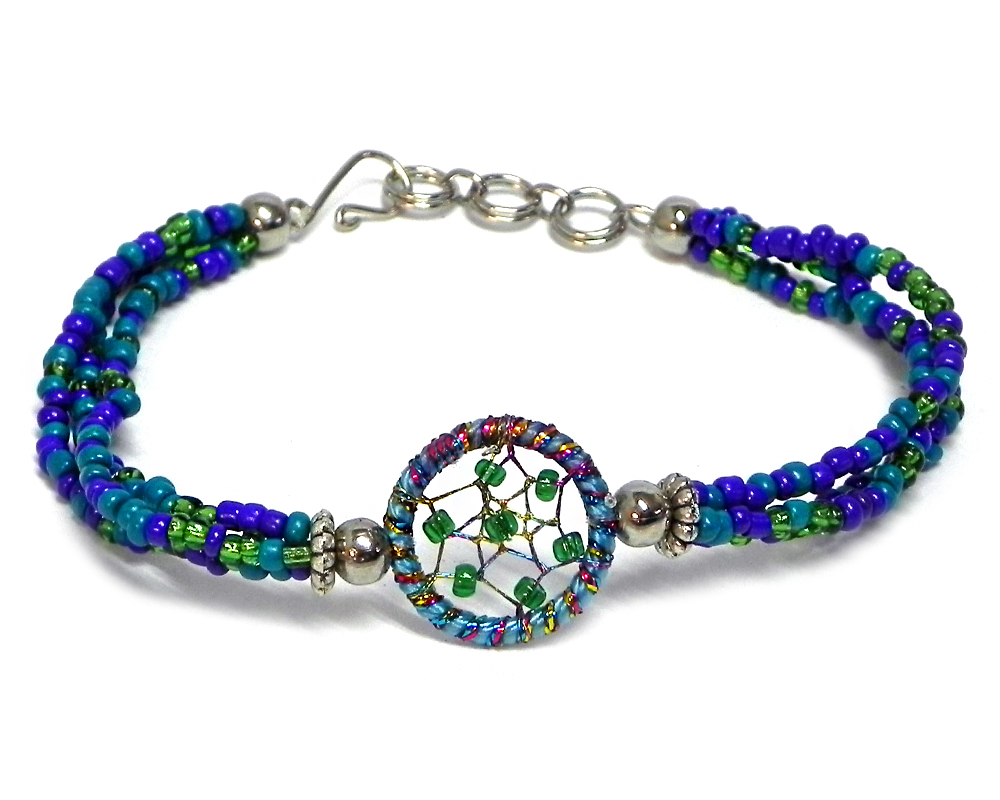 BR-050401540456 Handmade multicolored seed bead multi strand bracelet with round beaded sparkle thread dream catcher centerpiece in teal, turquoise blue, green, and indigo color combination.