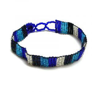 Handmade Czech glass seed bead thin strap bracelet with striped pattern design in blue, navy, turquoise, and silver color combination.