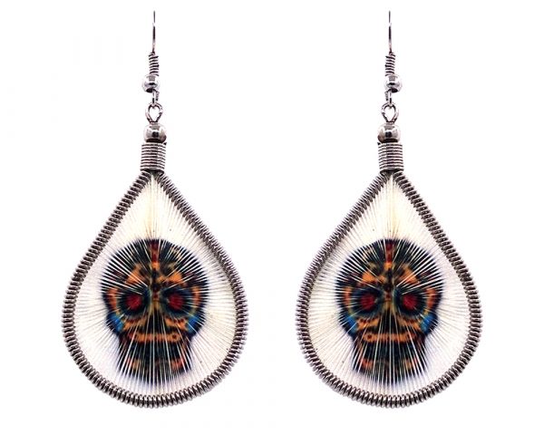 Teardrop-shaped thread dangle earrings with alpaca silver wire and Day of the Dead sugar skull graphic image in white, golden yellow, and multicolored color combination.