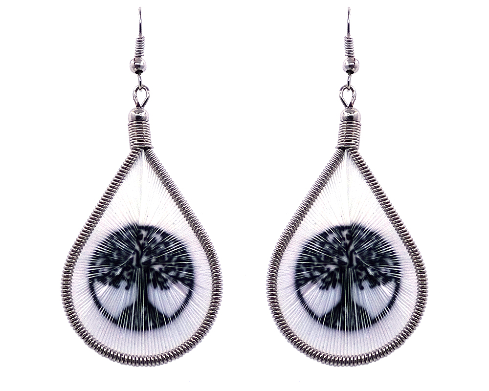 Teardrop-shaped thread dangle earrings with alpaca silver wire and tree of life graphic image in black and white color combination.