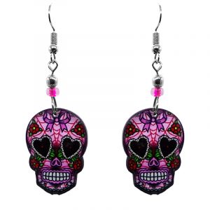 Day of the Dead bow sugar skull head acrylic dangle earrings with beaded metal hooks in pink, red, and black color combination.
