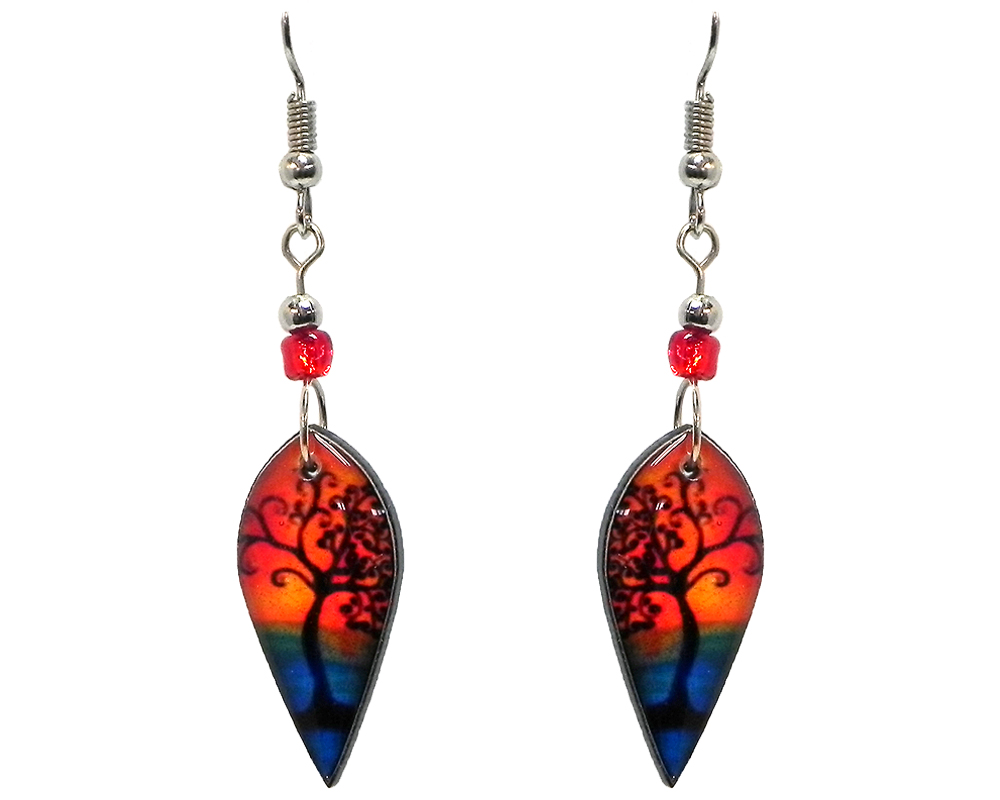 Ellipse-shaped New Age themed sunset tree of life graphic acrylic dangle earrings with beaded metal hooks in orange, blue, and black color combination.