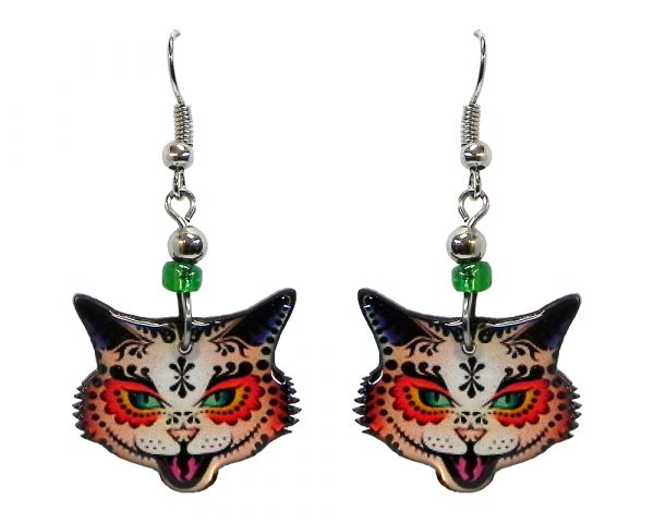 Tribal pattern sugar skull cat face acrylic dangle earrings with beaded metal hooks in orange, green, and black color combination.
