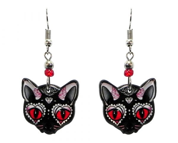 Diamond Day of the Dead sugar skull pattern cat face acrylic dangle earrings with beaded metal hooks in black, white, red, and pink color combination.