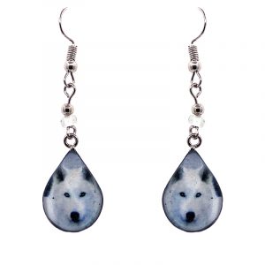 Teardrop-shaped arctic wolf face graphic acrylic dangle earrings with silver metal setting and beaded metal hooks in white, gray, and black color combination.