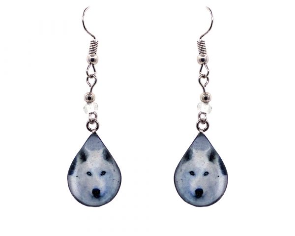 Teardrop-shaped arctic wolf face graphic acrylic dangle earrings with silver metal setting and beaded metal hooks in white, gray, and black color combination.