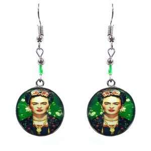 Handmade round silver floral Frida inspired earrings with acrylic, seed beads, and metal hooks in beige, black, and green color combination.