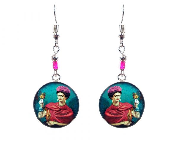 Handmade round silver Frida inspired earrings with acrylic, seed beads, and metal hooks in teal blue, hot pink, beige, and black color combination.