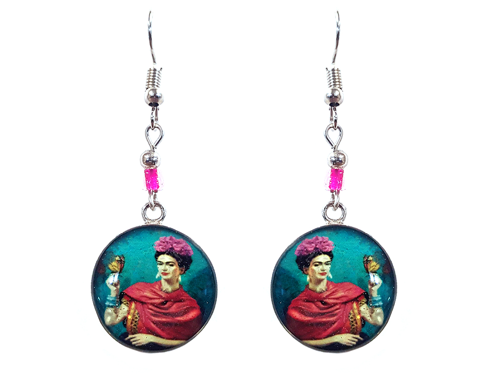 Handmade round silver Frida inspired earrings with acrylic, seed beads, and metal hooks in teal blue, hot pink, beige, and black color combination.