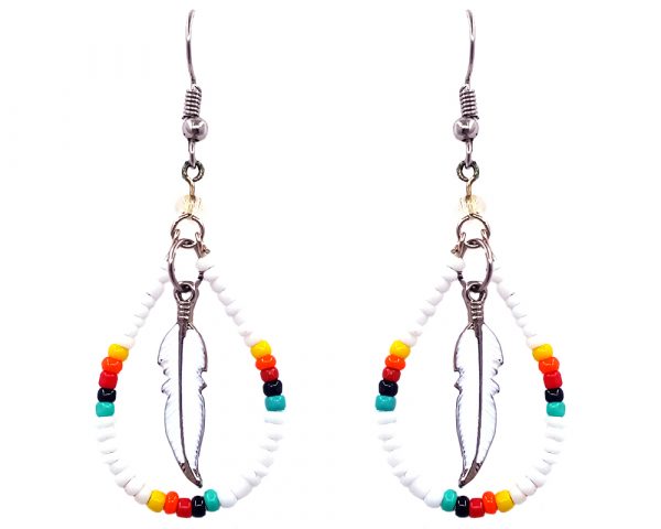 Handmade Native American inspired teardrop-shaped seed bead hoop earrings with colored metal feather charm inner dangle in white, yellow, orange, red, black, and mint green color combination.
