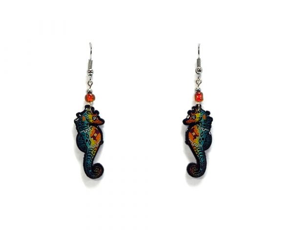 Tribal pattern seahorse acrylic dangle earrings with beaded metal hooks in orange, golden yellow, turquoise, black and white color combination.