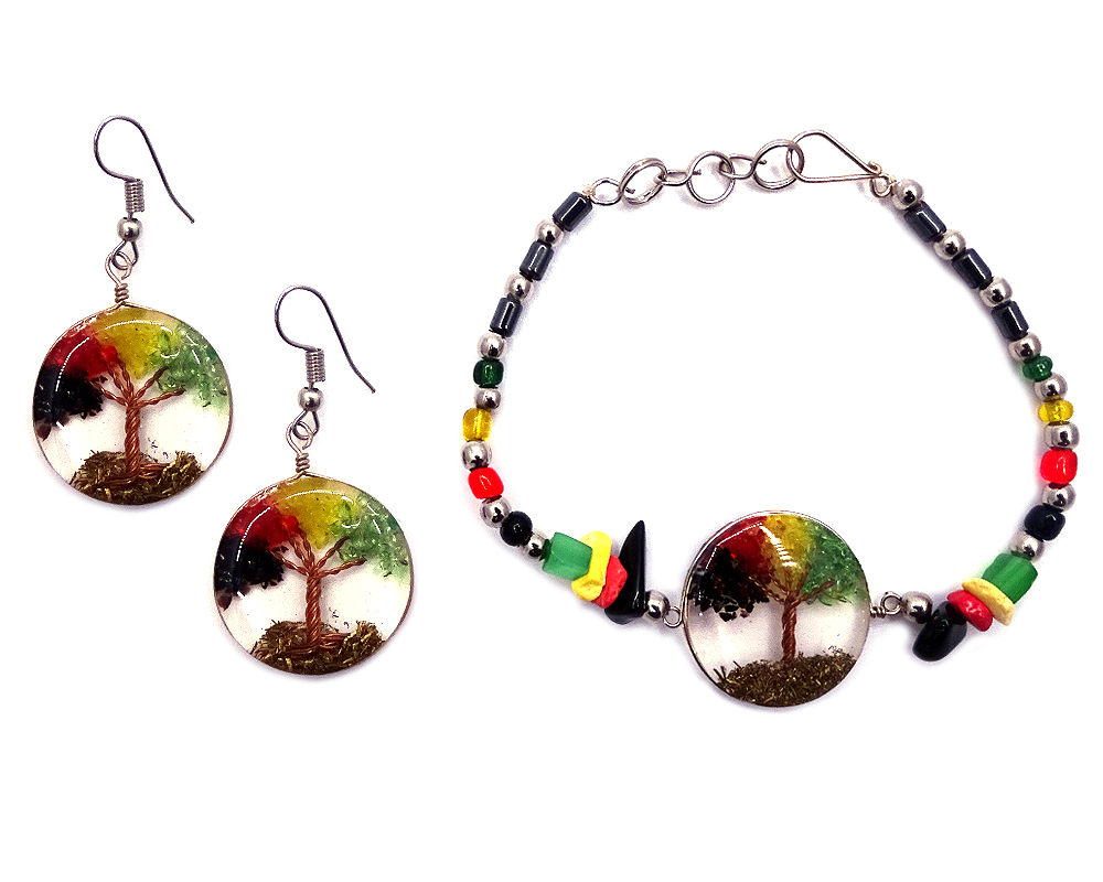 Handmade hematite, chip stone, and silver metal seed bead bracelet with round-shaped clear acrylic resin, copper wire, and crushed chip stone inlay tree of life centerpiece and matching dangle earrings in Rasta colors.