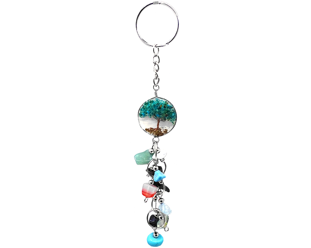 Handmade round clear acrylic resin, copper wire, and crushed chip stone inlay tree of life with long multicolored tumbled gemstone dangles on silver metal key ring in teal green chrysocolla.