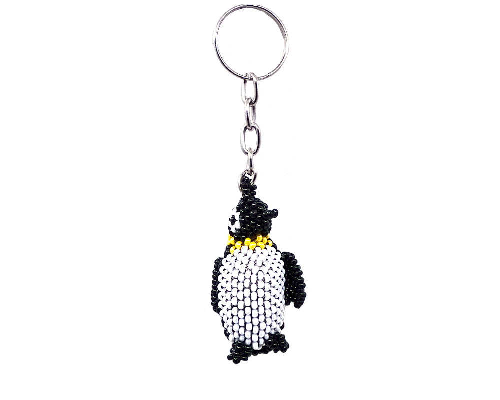 Handmade Czech glass seed bead figurine keychain of a penguin bird in black, white, and yellow color combination.