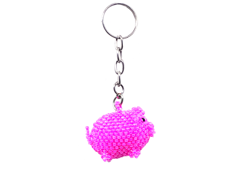 Handmade Czech glass seed bead figurine keychain of a pig in pink and black color combination.