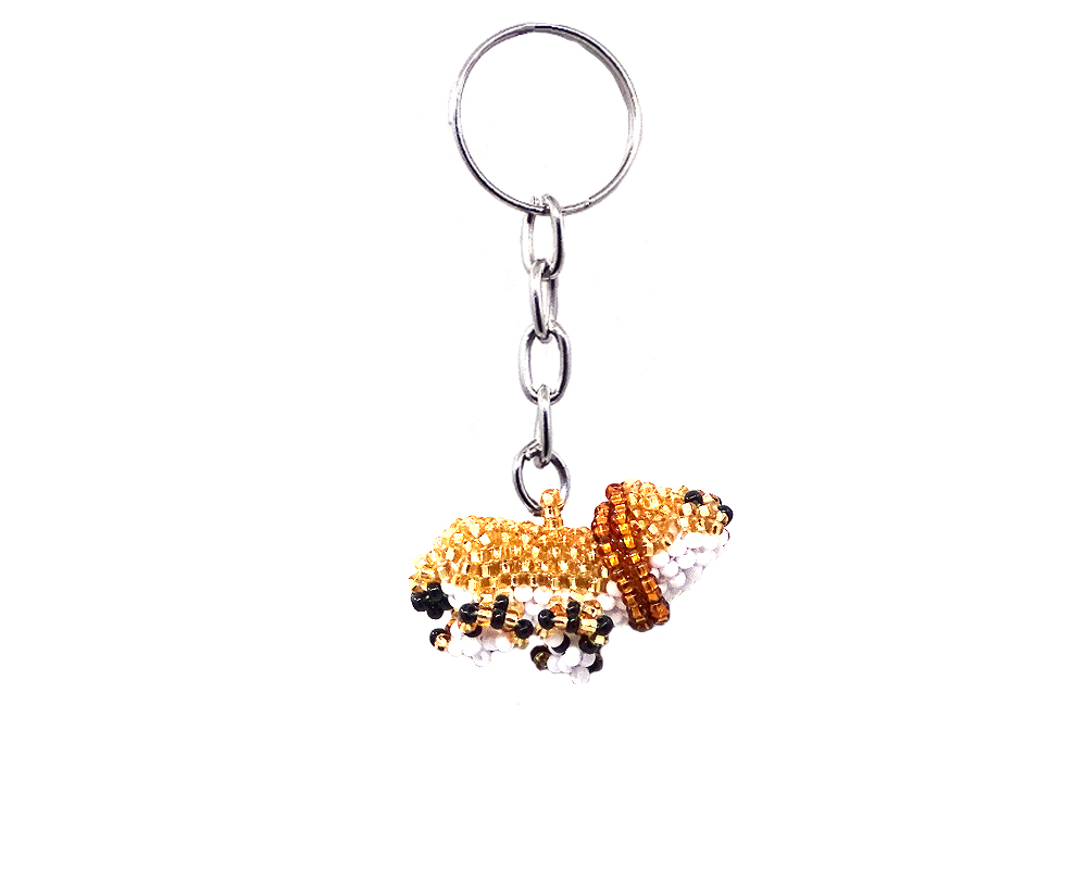 Handmade Czech glass seed bead figurine keychain of a lion in gold, brown, white, and black color combination.