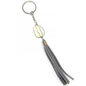 Handmade wire wrapped tumbled gemstone crystal with suede tassel dangle on silver metal key ring in gray color and iridescent white opalite.