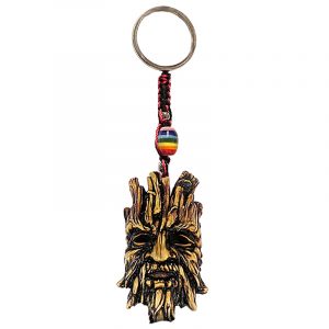 Handmade durepox resin figurine keychain of a brown tree man face.