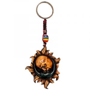Handmade durepox resin figurine keychain of a kissing sun and crescent half moon in yellow and blue color combination.