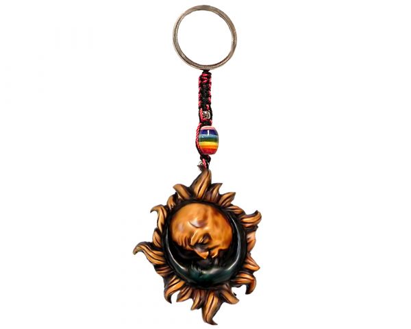Handmade durepox resin figurine keychain of a kissing sun and crescent half moon in yellow and blue color combination.
