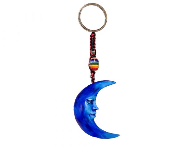 Handmade durepox resin figurine keychain of a blue crescent half moon with face.