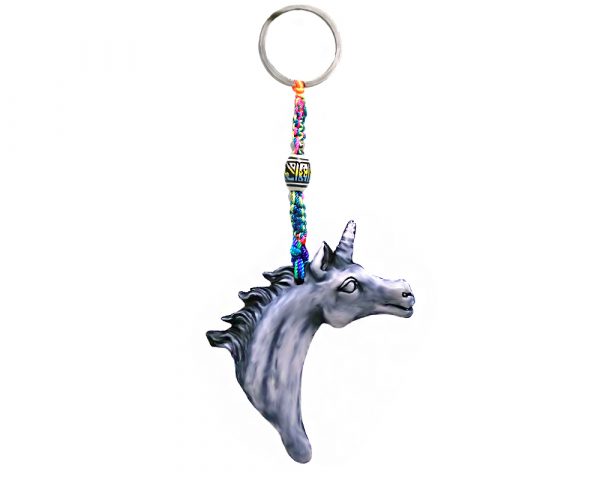 Handmade durepox resin figurine keychain of a white and gray unicorn head.