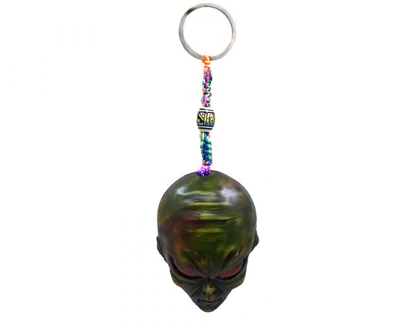 Handmade durepox resin figurine keychain of a green alien head.