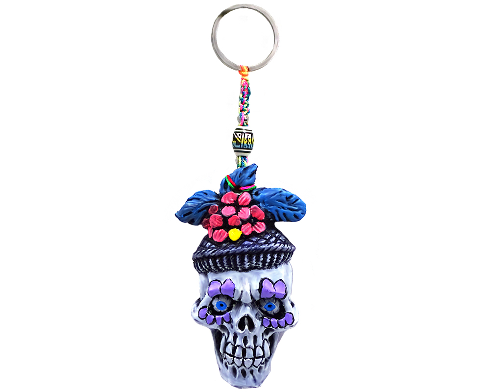 KC-05050501 Handmade durepox resin figurine keychain of a New Orleans themed Mardi Gras sugar skull with a purple and multicolored floral designs.