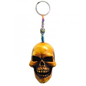 Handmade durepox resin figurine keychain of a beige skull.