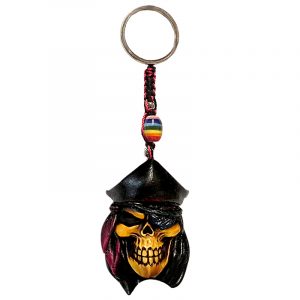 Handmade durepox resin figurine keychain of a pirate skull with a red captain hat and an eye patch.
