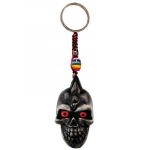 Handmade durepox resin figurine keychain of a gray skull with a spiked mohawk.