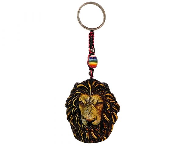 Handmade durepox resin figurine keychain of a lion head in beige color.