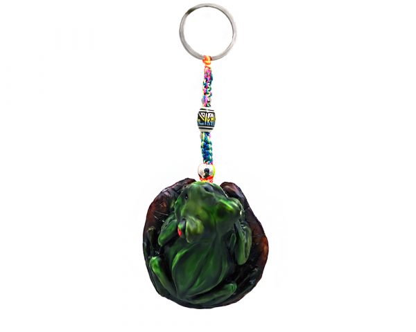 Handmade durepox resin figurine keychain of a sitting green tree frog with red eyes.