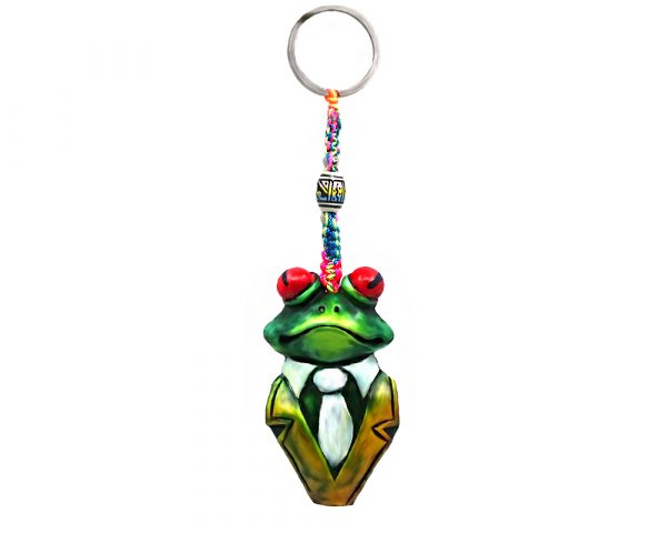 Handmade durepox resin figurine keychain of a green tree frog with red eyes wearing a tuxedo suit.