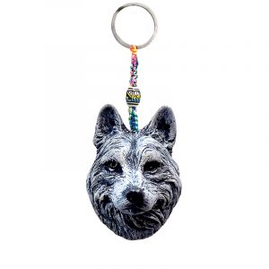 Handmade durepox resin figurine keychain of a white Pomsky dog head.