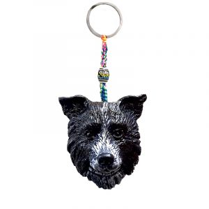 Durepox resin figurine keychain of a black and white Border Collie dog head.