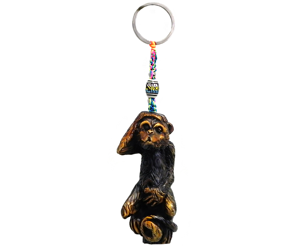 Handmade durepox resin figurine keychain of a brown monkey.