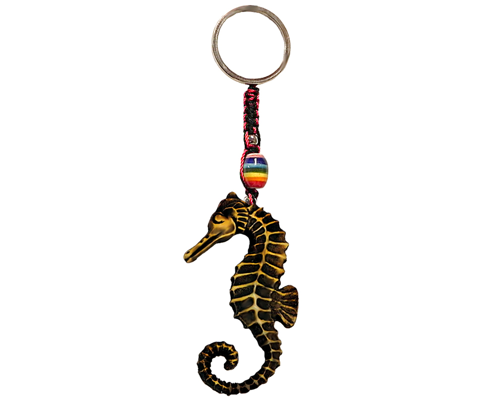 Handmade durepox resin figurine keychain of a golden-colored seahorse.