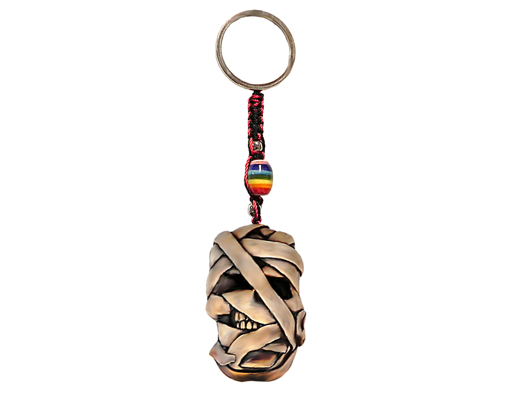 Handmade durepox resin figurine keychain of a wrapped mummy head.