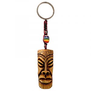 Handmade durepox resin figurine keychain of a tiki head mask with big lips.