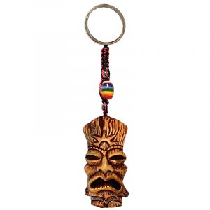 Handmade durepox resin figurine keychain of a tiki head mask with a rising sun design.
