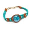 BR-010100545408 Handmade braided dyed leather bracelet with brown resin, gold-colored metal, and round-shaped glass bead centerpiece in teal green and turquoise blue color combination.
