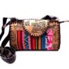 Handmade small Peruvian purse bag with authentic leather, acrylic wool, snap button and zipper closure, and adjustable strap in multicolored and brown.
