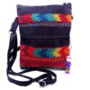 MB-030103999909-0 Handmade medium-sized slim rectangle-shaped crossbody purse bag with multicolored huipil embroidered tribal pattern design, black vegan leather suede, and worry doll keychain.