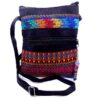 MB-030103999909-1 Handmade medium-sized slim rectangle-shaped crossbody purse bag with multicolored huipil embroidered tribal pattern design, black vegan leather suede, and worry doll keychain.